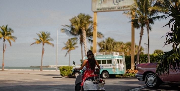 Guest riding a scooter near the Havana Cabana Key West entrance