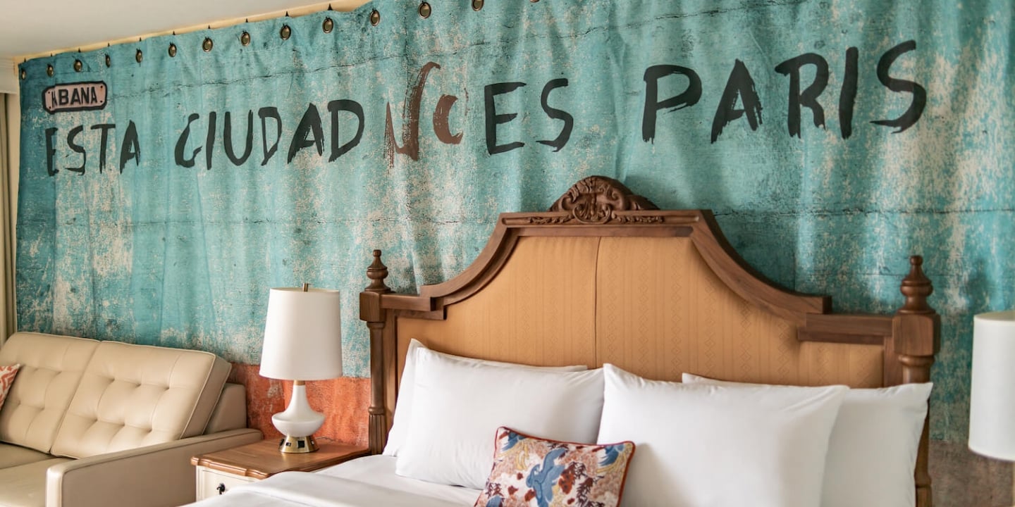 The wall of a Key West hotel room, written in black letters is 