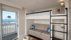 Interior view of a room at Havana Cabana equipped with a bunk bed.